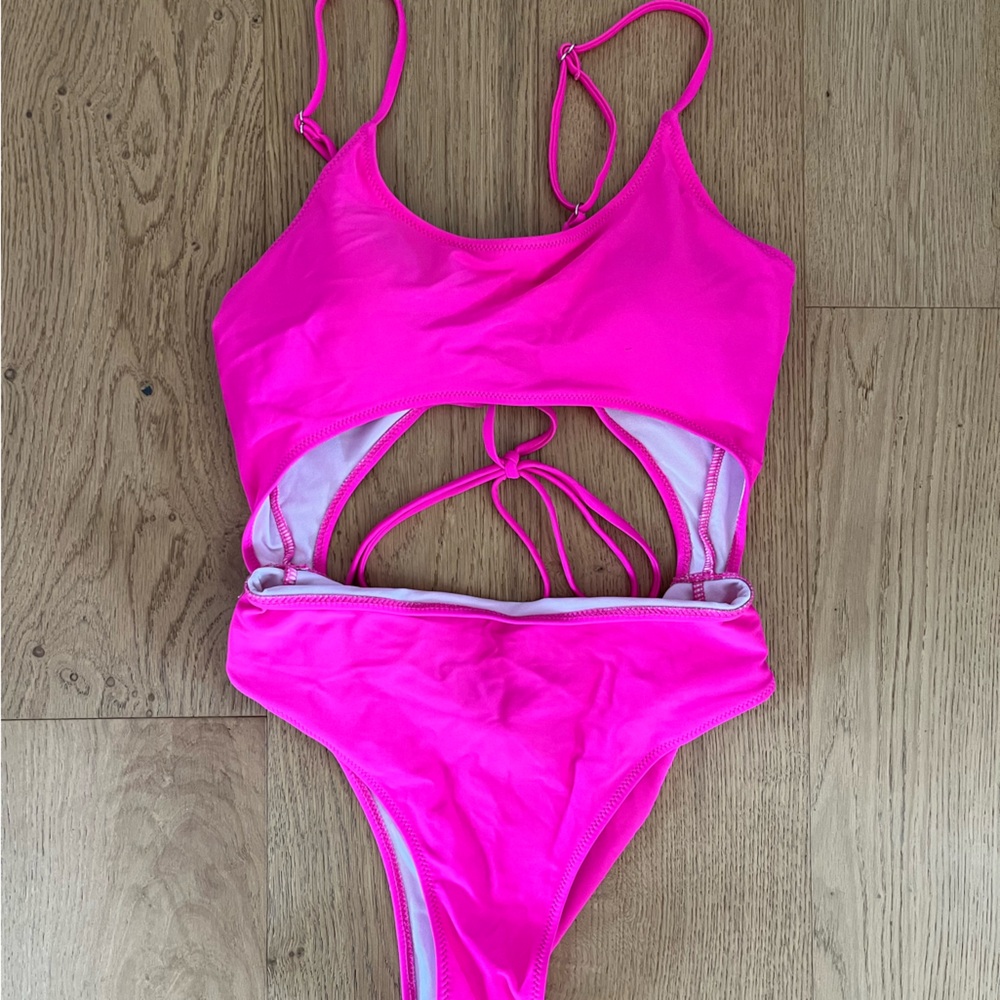 Women’s hot pink bikini size Large with detailed lace back and open stomach